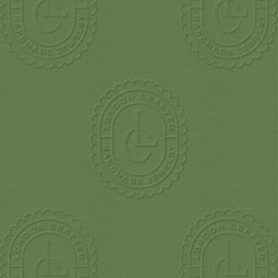 Embossed logo mockup for London Crafted on green background